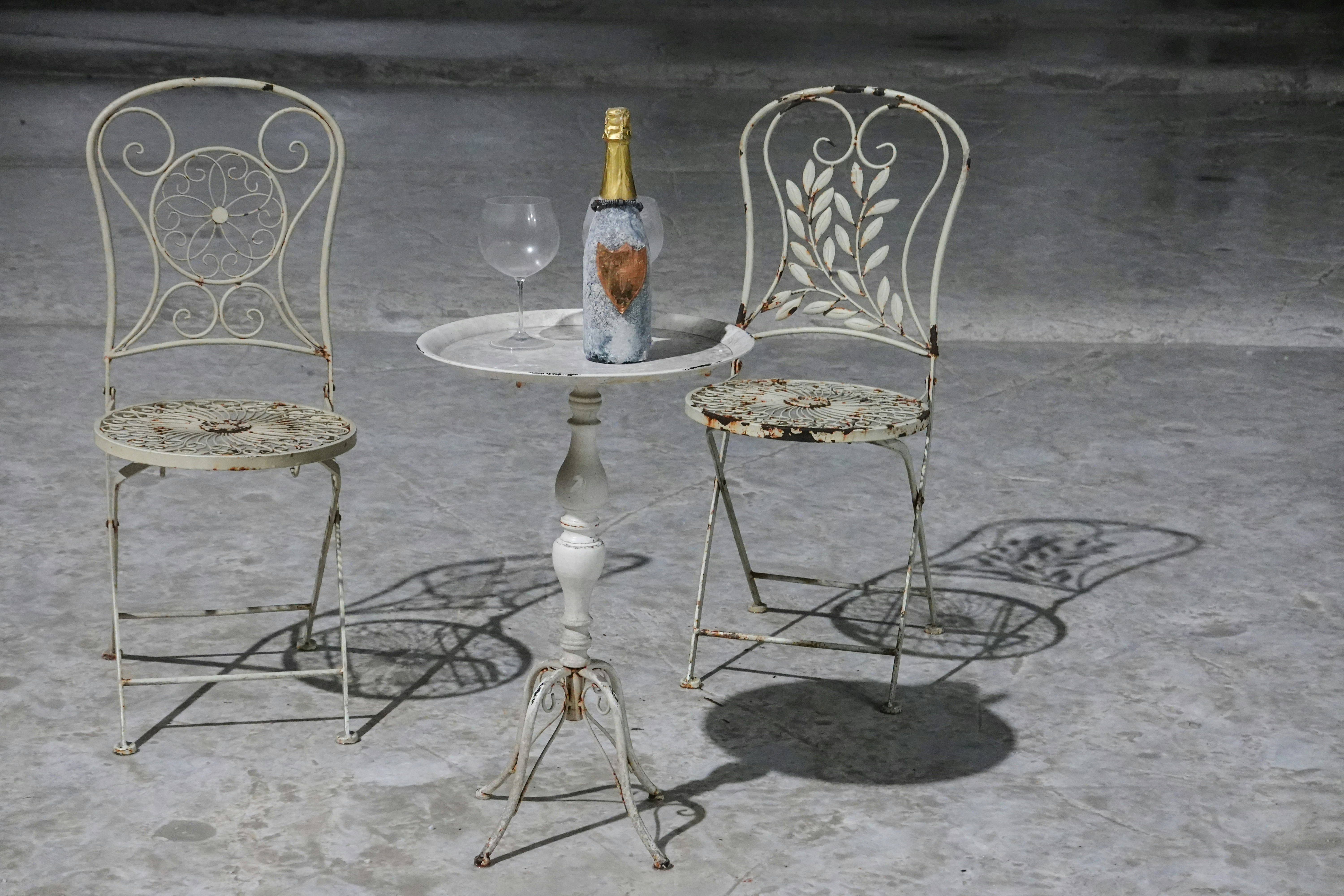 2 white and brown ceramic vases on table