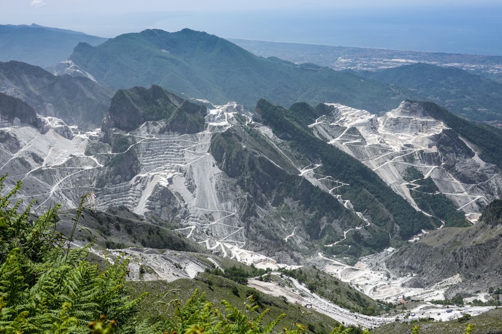 gray and white mountains under white sky during daytime