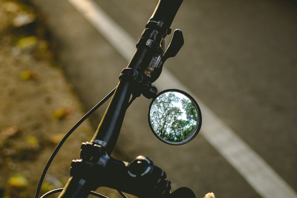 black motorcycle side mirror in close up photography