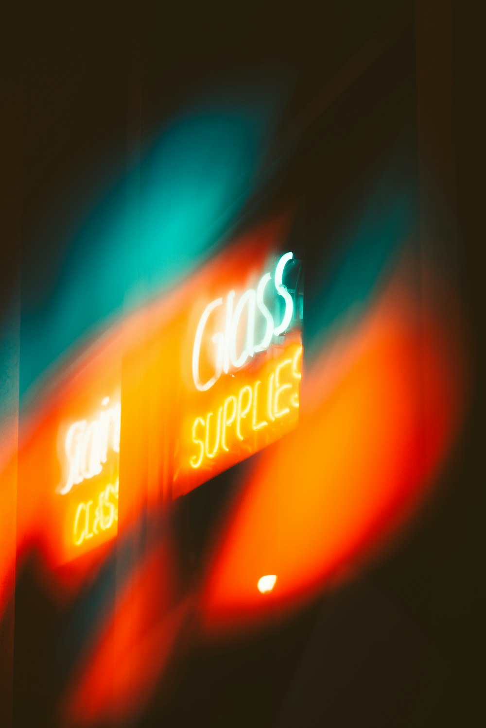 a blurry photo of a cross and supply sign
