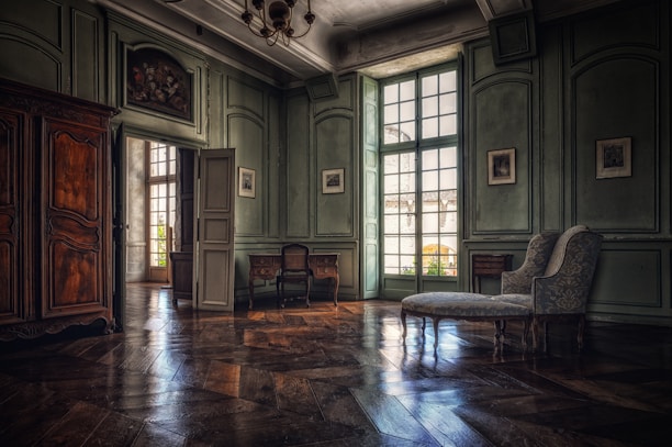 living room with brown wooden floor and white wooden door