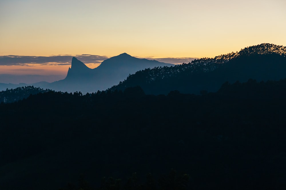 silhouette of mountain during sunset