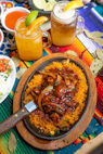 brown wooden round plate with cooked food