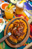 brown wooden round plate with cooked food