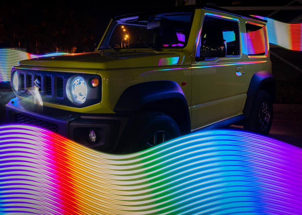 yellow and green car on road during night time