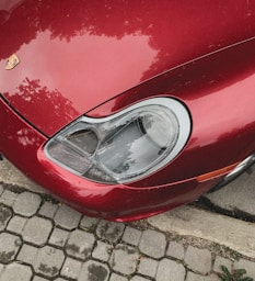 red car on gray brick floor