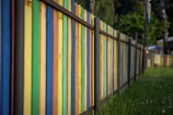white blue and yellow wooden fence