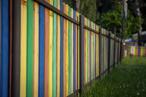 white blue and yellow wooden fence