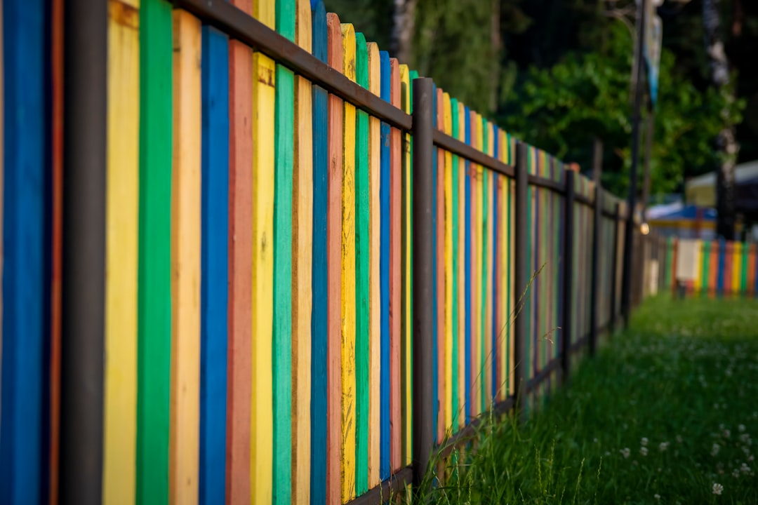 white blue and yellow wooden fence