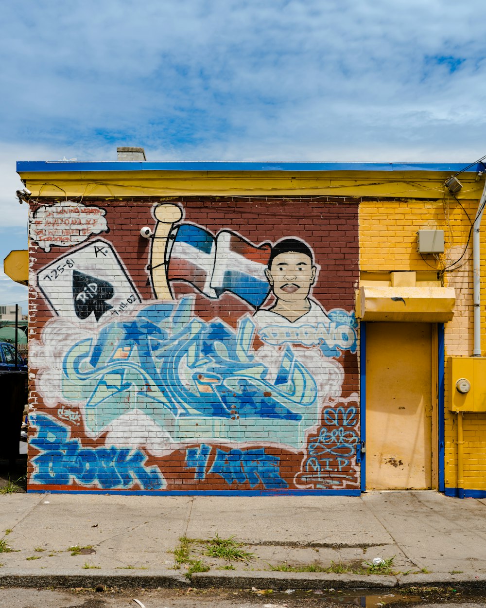 red blue and white graffiti on wall