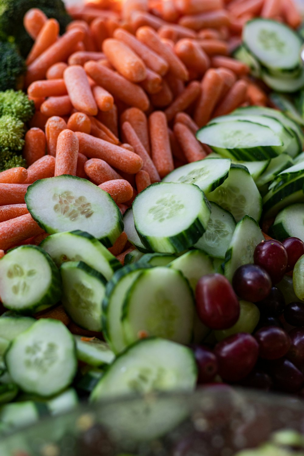 sliced cucumber and carrots on white ceramic plate