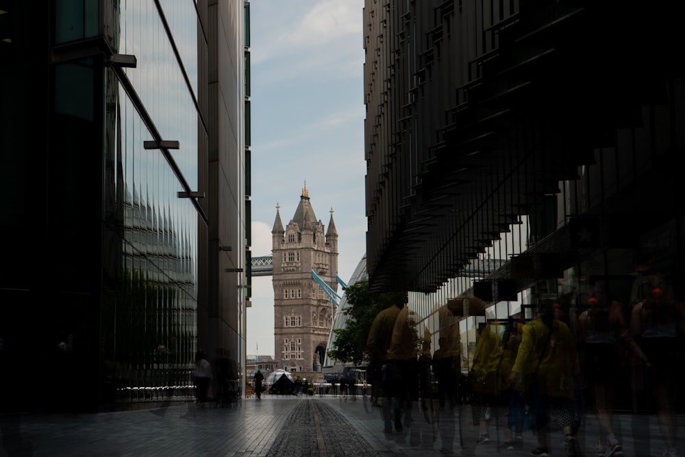 people walking on street near high rise buildings during daytime