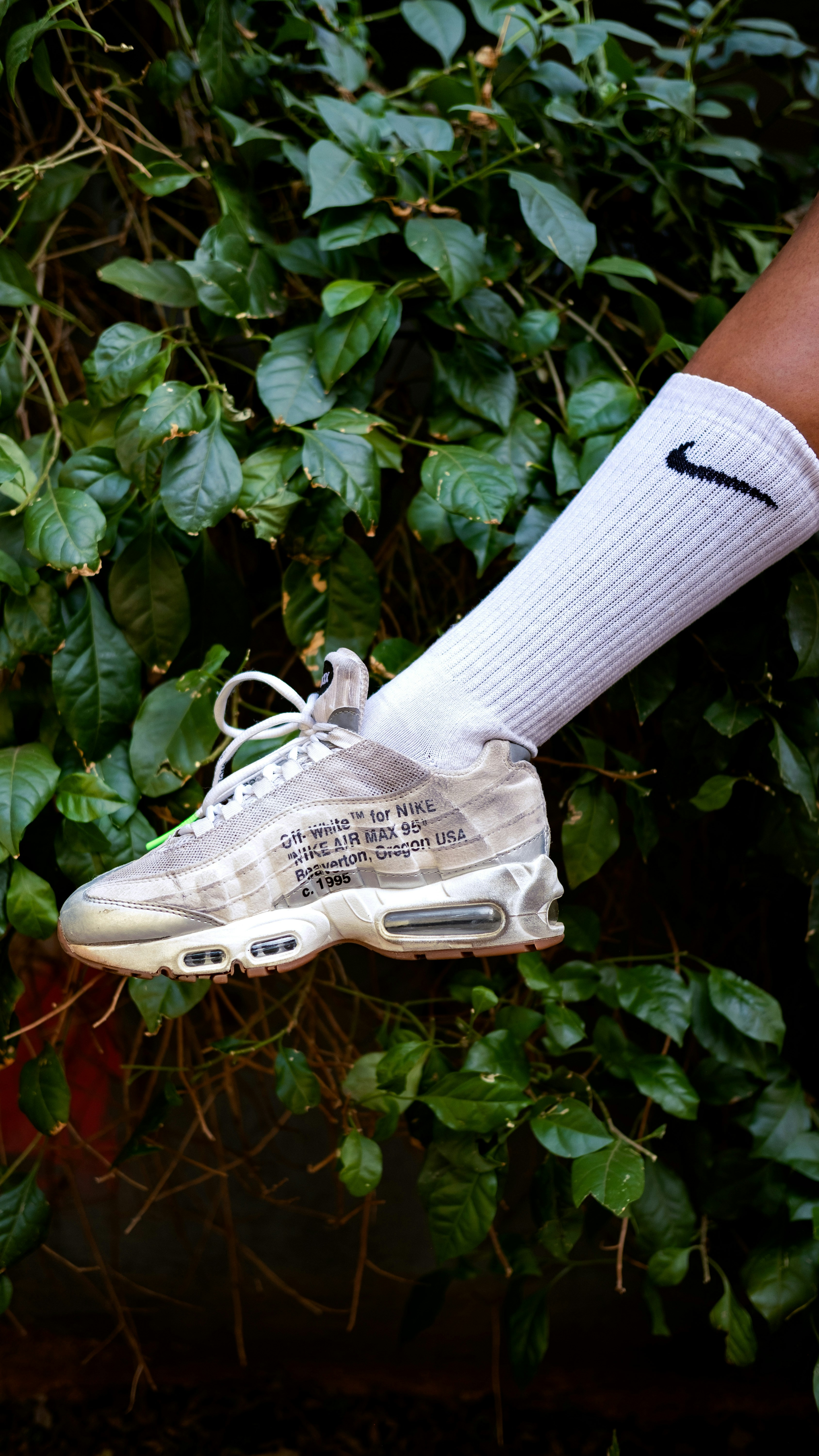 Person wearing white nike athletic shoe photo Free Johannesburg Image