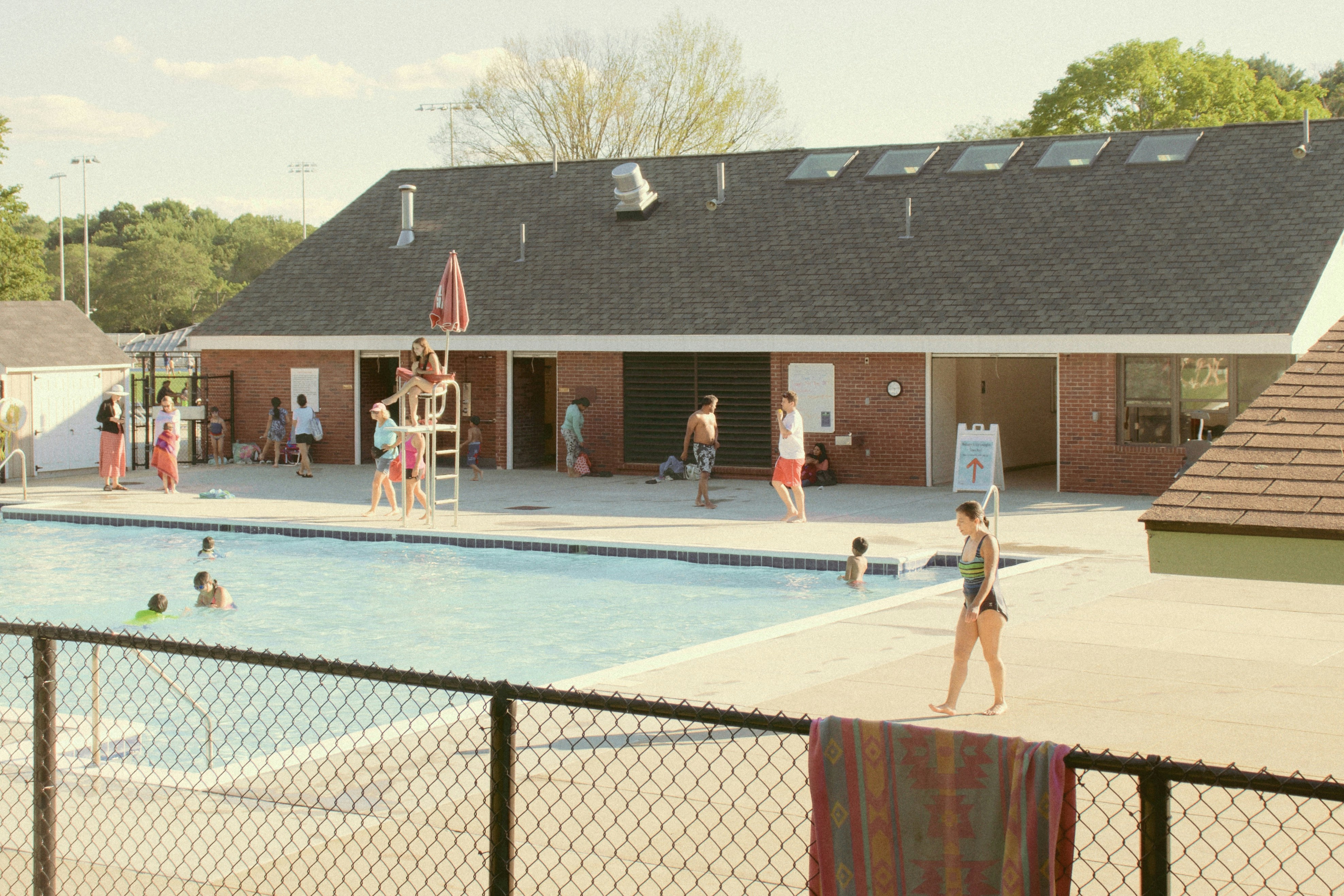 people in swimming pool during daytime