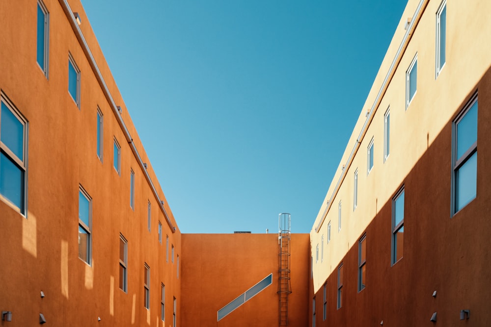 brown concrete building under blue sky during daytime