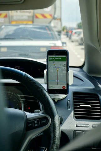 Driver checking a route on a tablet before a scheduled pickup.