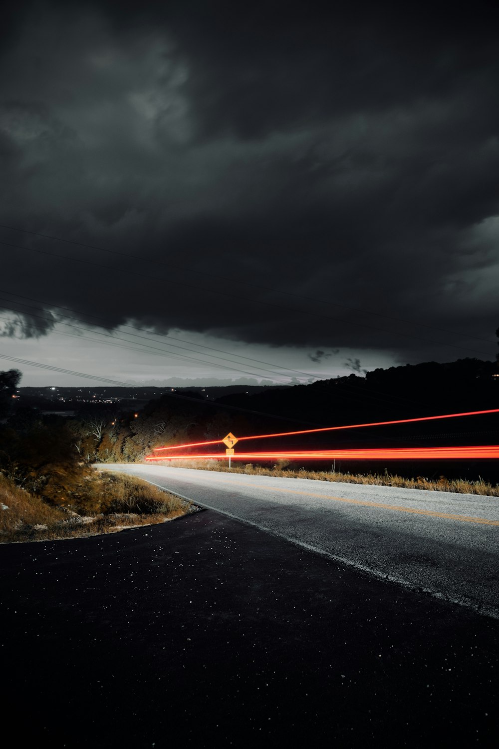 gray concrete road under gray clouds