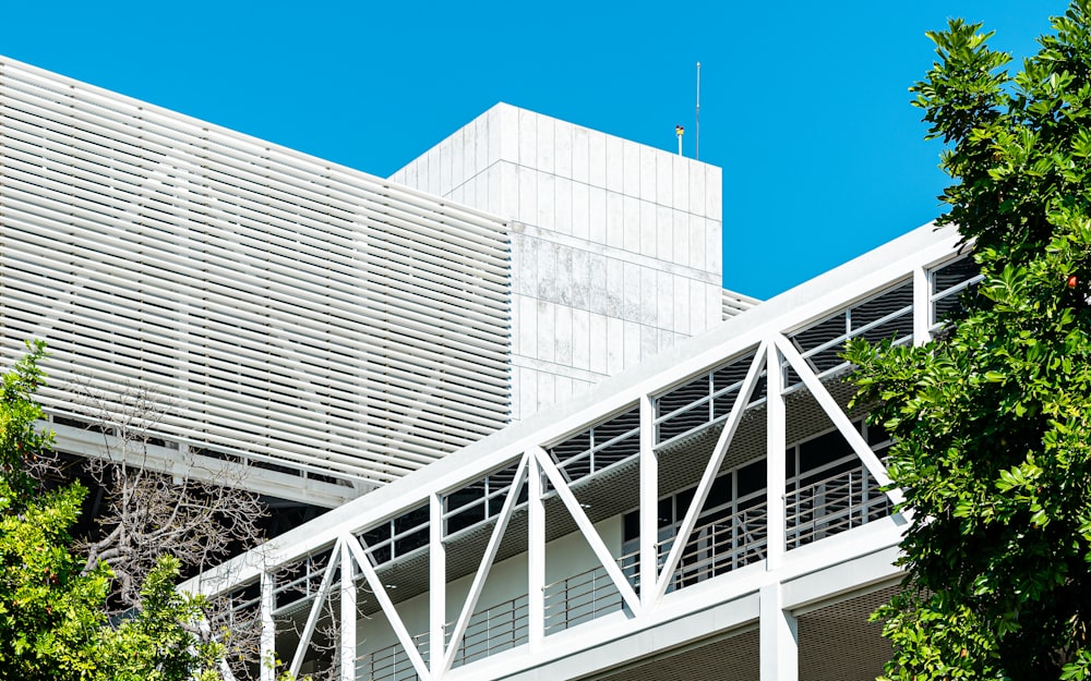 white metal frame near white concrete building during daytime