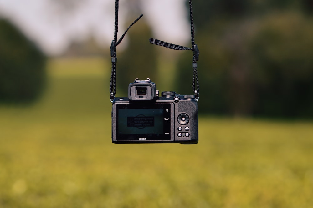 black and silver point and shoot camera