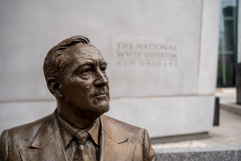 man in suit jacket statue