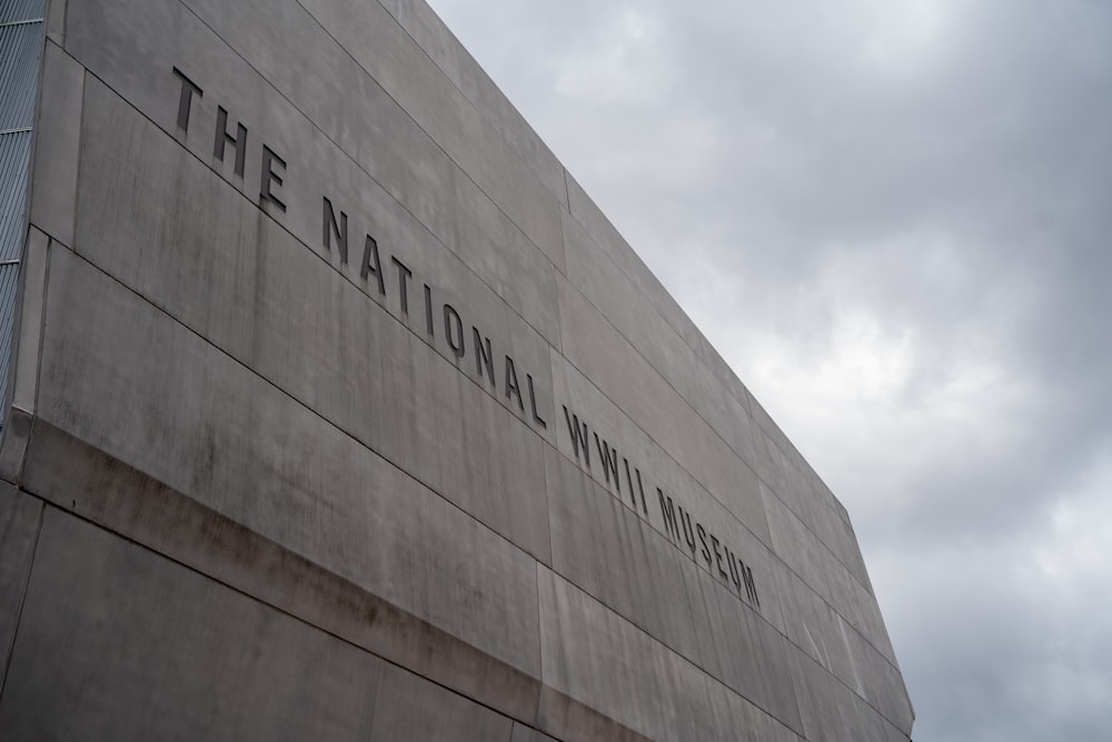 brown and white concrete building under white clouds during daytime