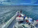 A group of anglers enjoying a day of fishing on a charter boat.