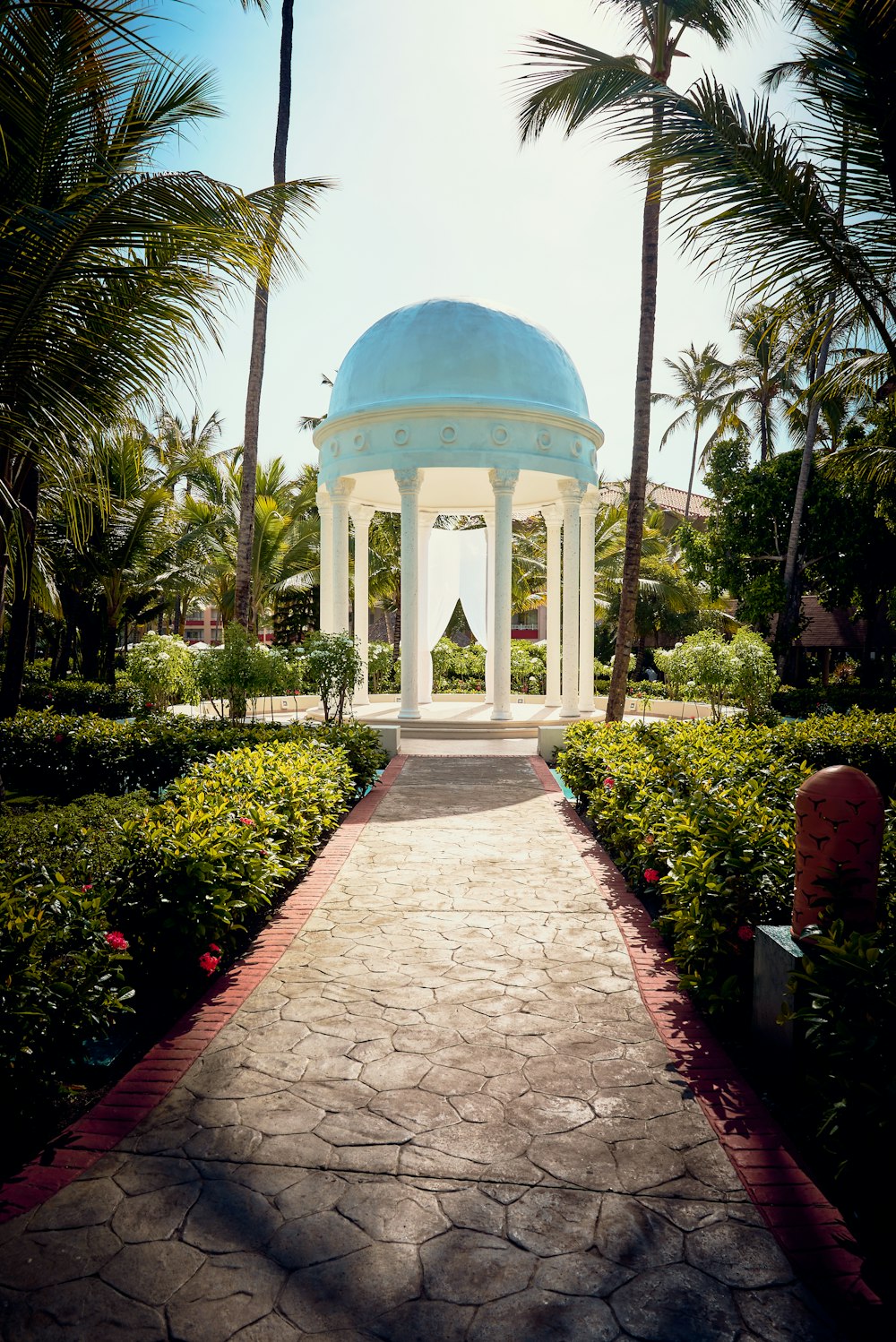 white and blue dome building surrounded by green trees during daytime