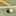 white and black soccer ball on green grass field