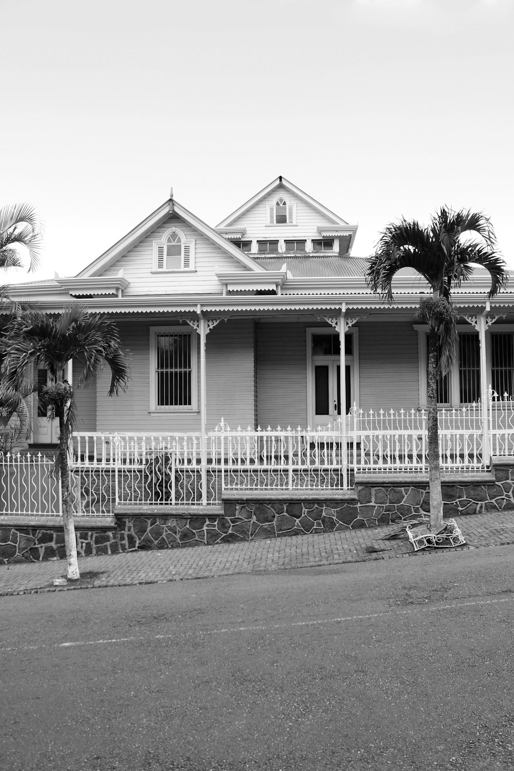 grayscale photo of wooden house