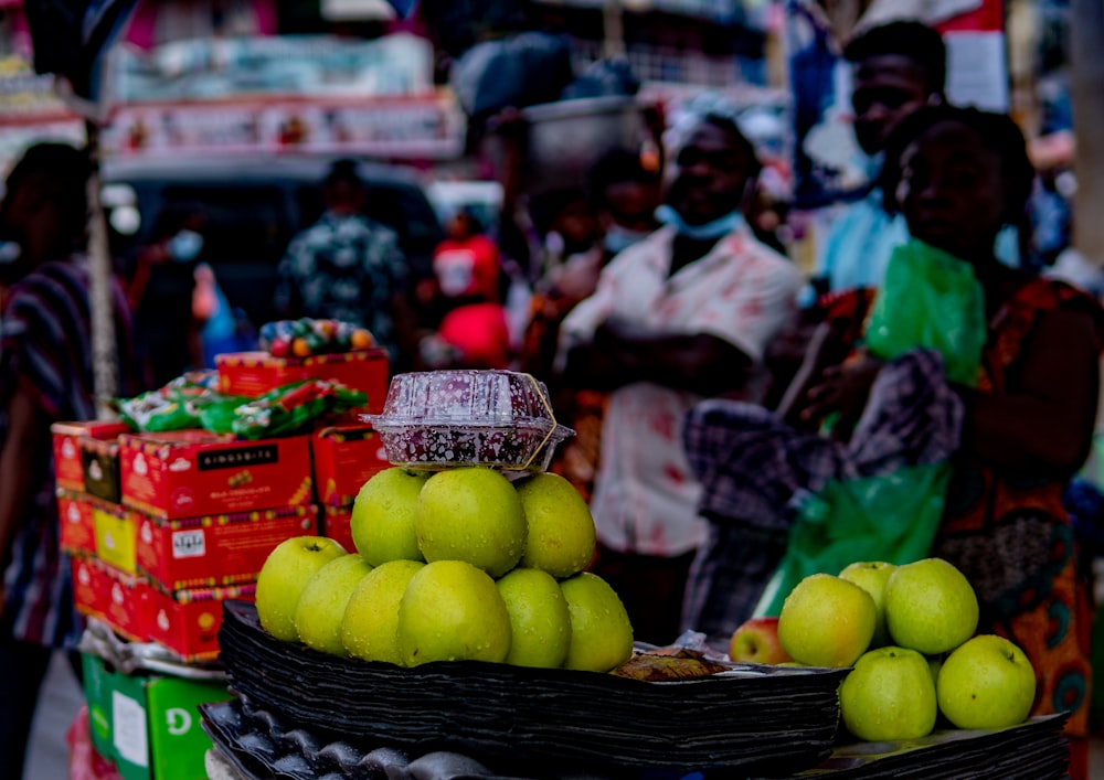 green apples on black plastic basket