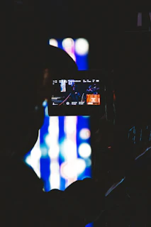 black flat screen tv turned on displaying man in black suit