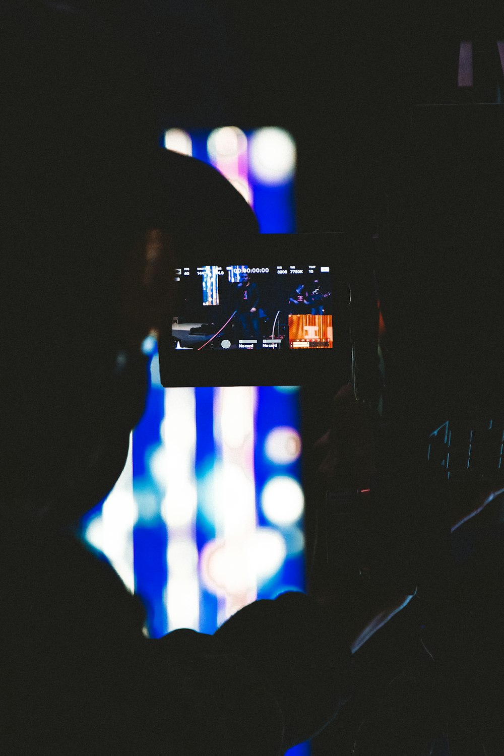 black flat screen tv turned on displaying man in black suit