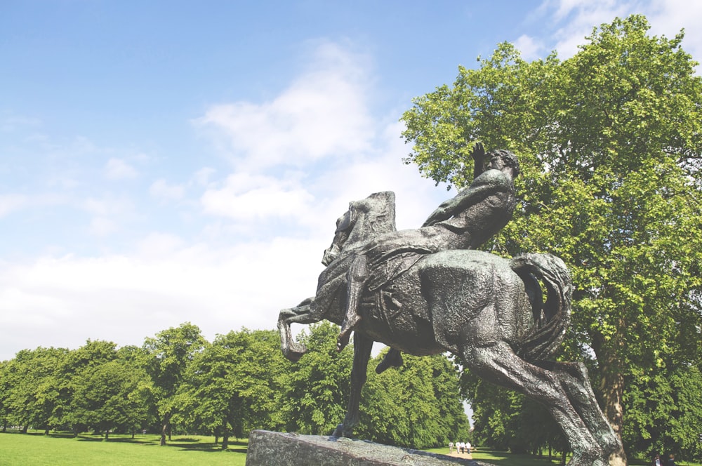 black statue of man riding horse