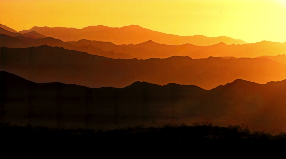 silhouette of mountain during sunset