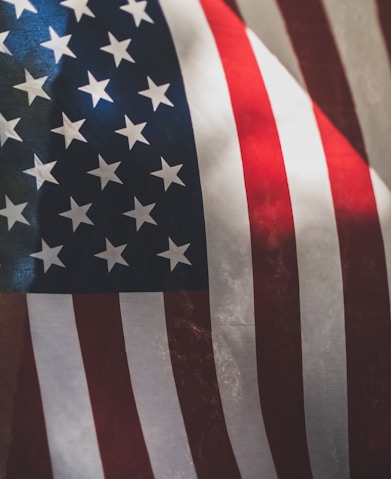 us a flag on white and red textile