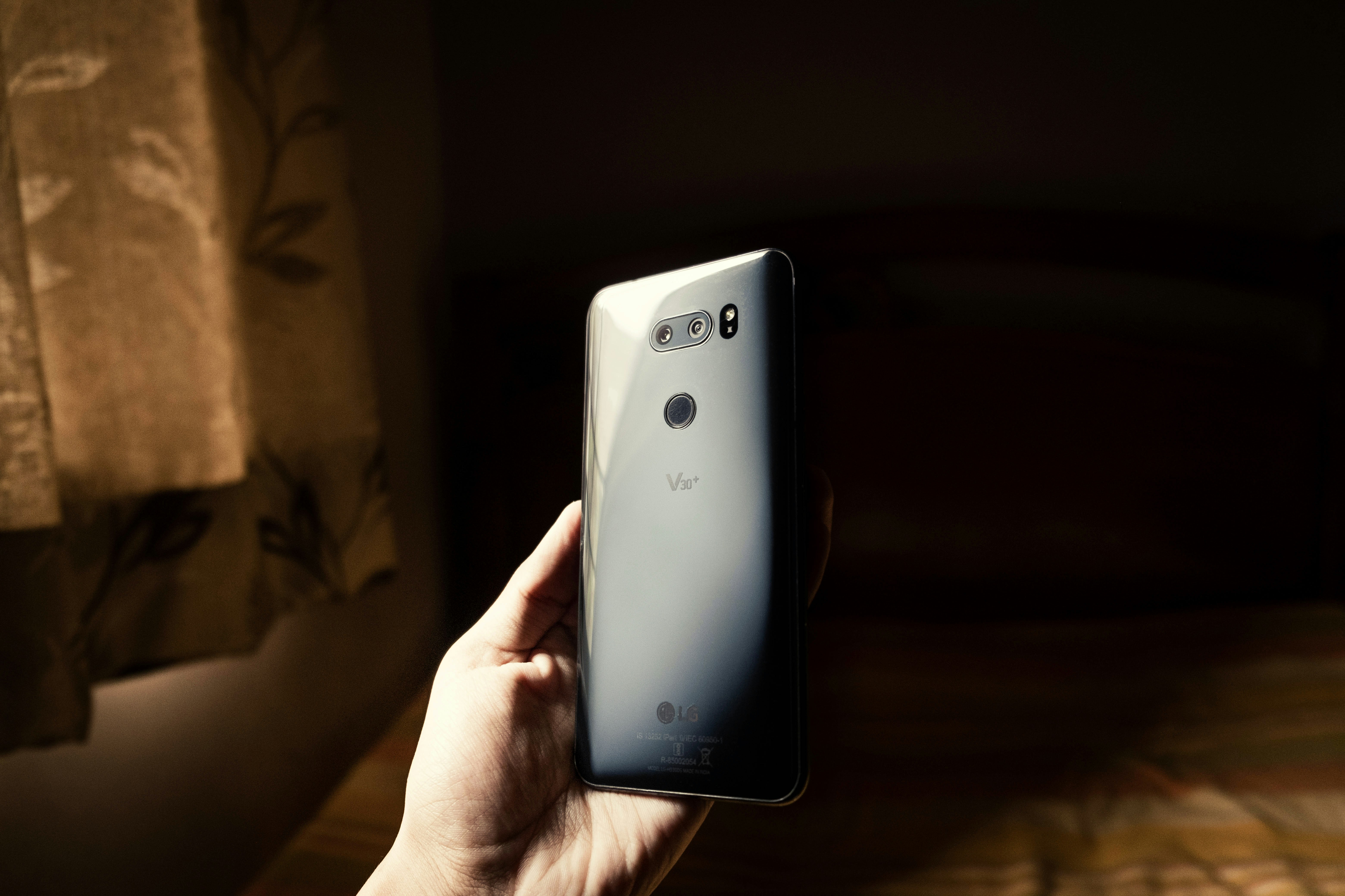 person holding black samsung android smartphone