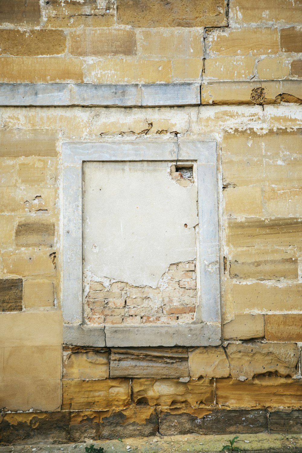white wooden door on brown brick wall