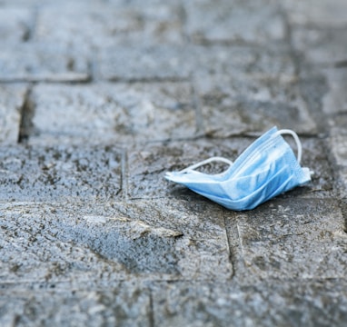 white plastic bag on gray concrete floor