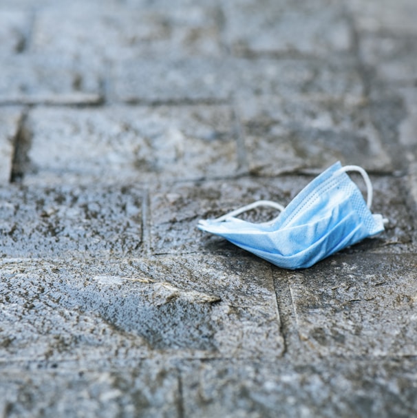 white plastic bag on gray concrete floor