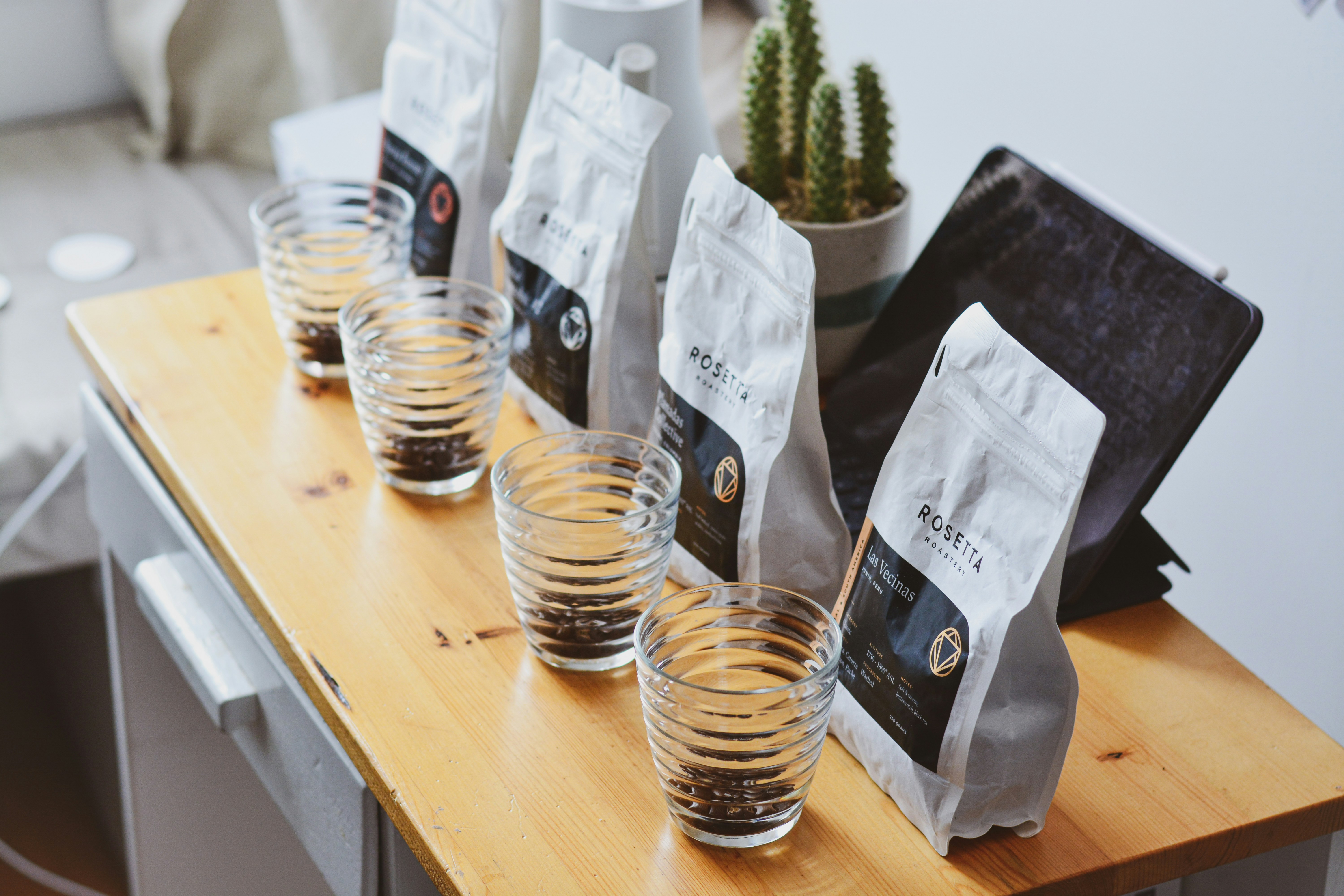 A professional barista carefully pouring latte art into a coffee cup, showcasing passion and skill.