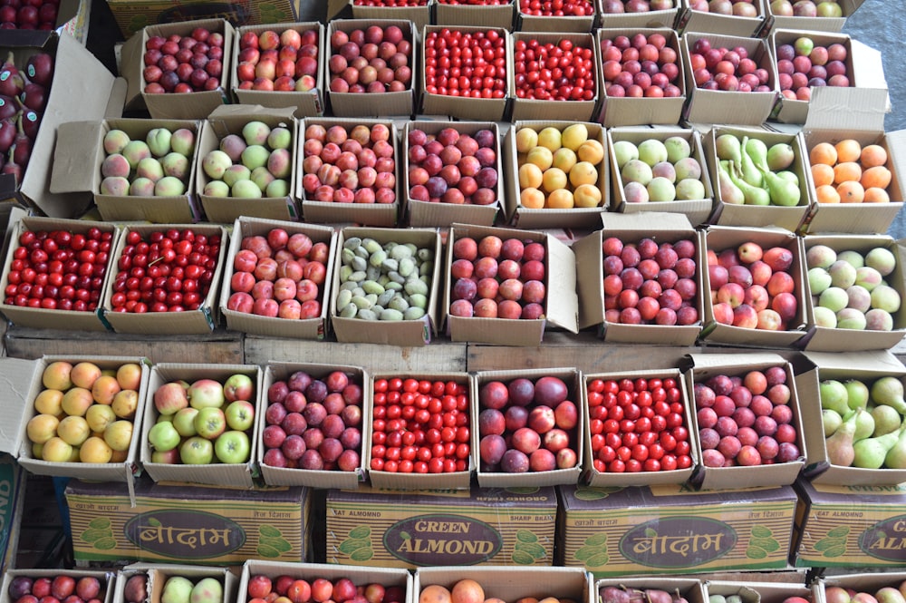 green and red apples on brown wooden crate