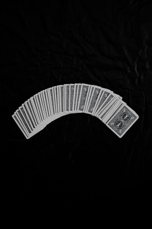 A collection of magic accessories and playing cards displayed elegantly on a dark background.