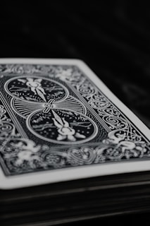 A close-up of a cheekydecks playing card featuring a creator's vibrant portrait and QR code.