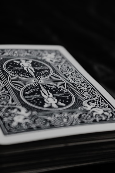 A close-up of a cheekydecks playing card featuring a creator's vibrant portrait and QR code.