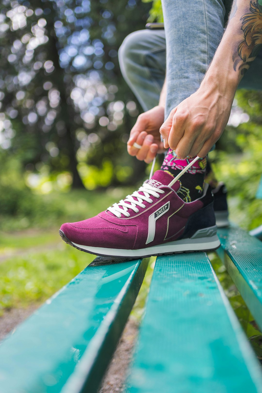 person wearing purple and white nike athletic shoes