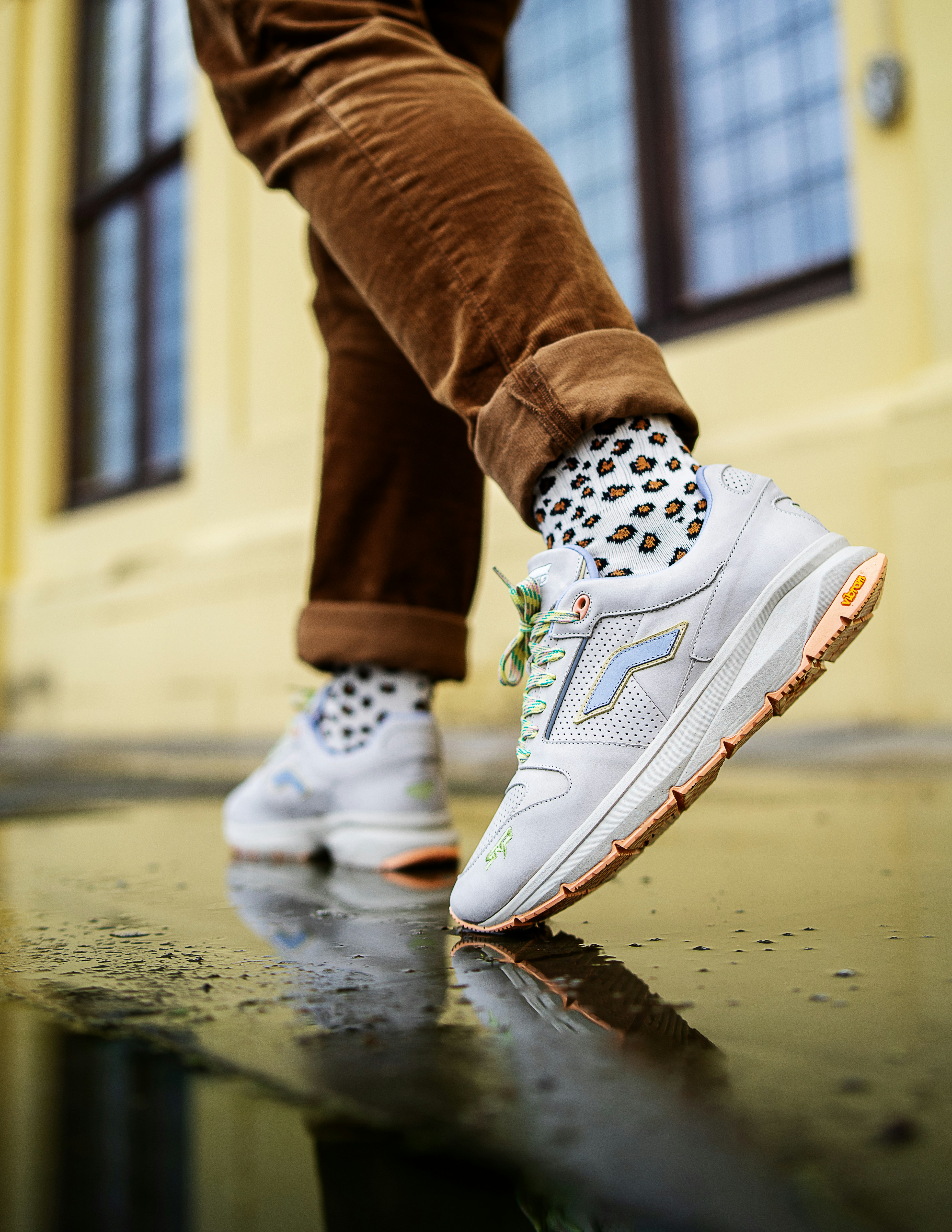 person wearing white nike sneakers