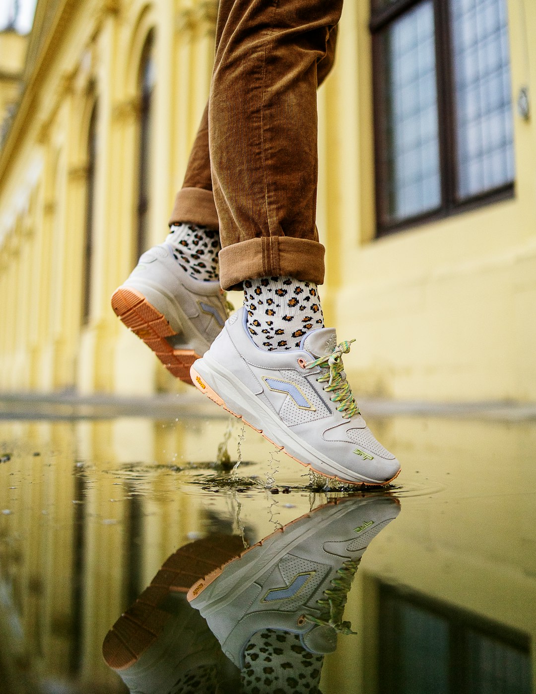 person in blue denim jeans and white nike sneakers