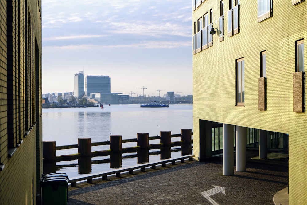 brown concrete building near body of water during daytime