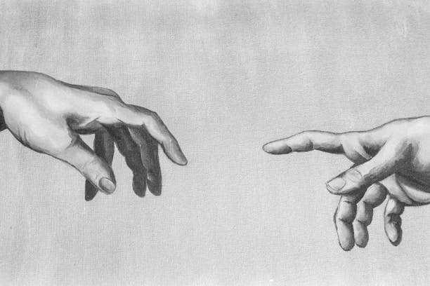 grayscale photo of 2 hands