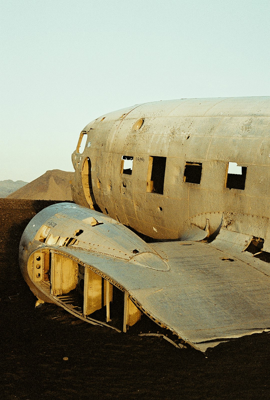 wrecked white and brown airplane